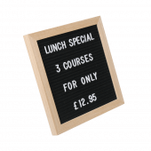 Black felt letter board counter standing with characters