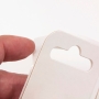 Cardboard adhesive hanging tabs for recyclable merchandising