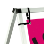 The frame secures with ground pegs and the banner attaches with bungee cords