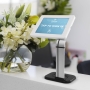 White Countertop Tablet Holder used on a hotel check in desk 