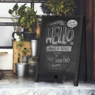Wooden chalkboard which folds away for compact storage