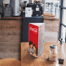 Three sided menu holder on a café table