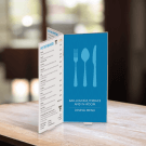 Six Sided Acrylic Menu Holder on a restaurant tabletop