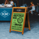 Branded wooden A frame with chalkboard and poster