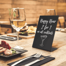 Miniature tabletop chalkboard sign being used in a restaurant
