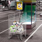 White Dump Bin displaying footballs in a sports retail store