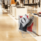 Display of cushions in a dump bin within a department store