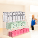 Countertop acrylic display stand holding cosmetics