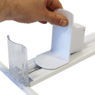 Slow feed product pusher with slow down damper for a gentle roll