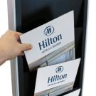 Freestanding digital advertising screen with magazine rack