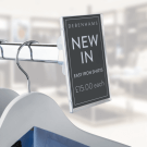 Reflex Graphic Holder on the end of a clothes rail