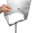 Unlock the free standing donation box and lift header to access contents