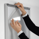 Thin LED poster frame with snap frame design for easy poster changes