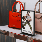 A metal table poster stand is perfect for retail applications
