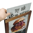 Posters slide into the wood chalkboard frame from the top