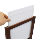 Posters slide into the wood chalkboard frame from the top