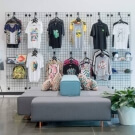 Mount black grid mesh panels on walls to create versatile retail displays