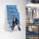 Wall mounted leaflet holder displaying promotional materials
