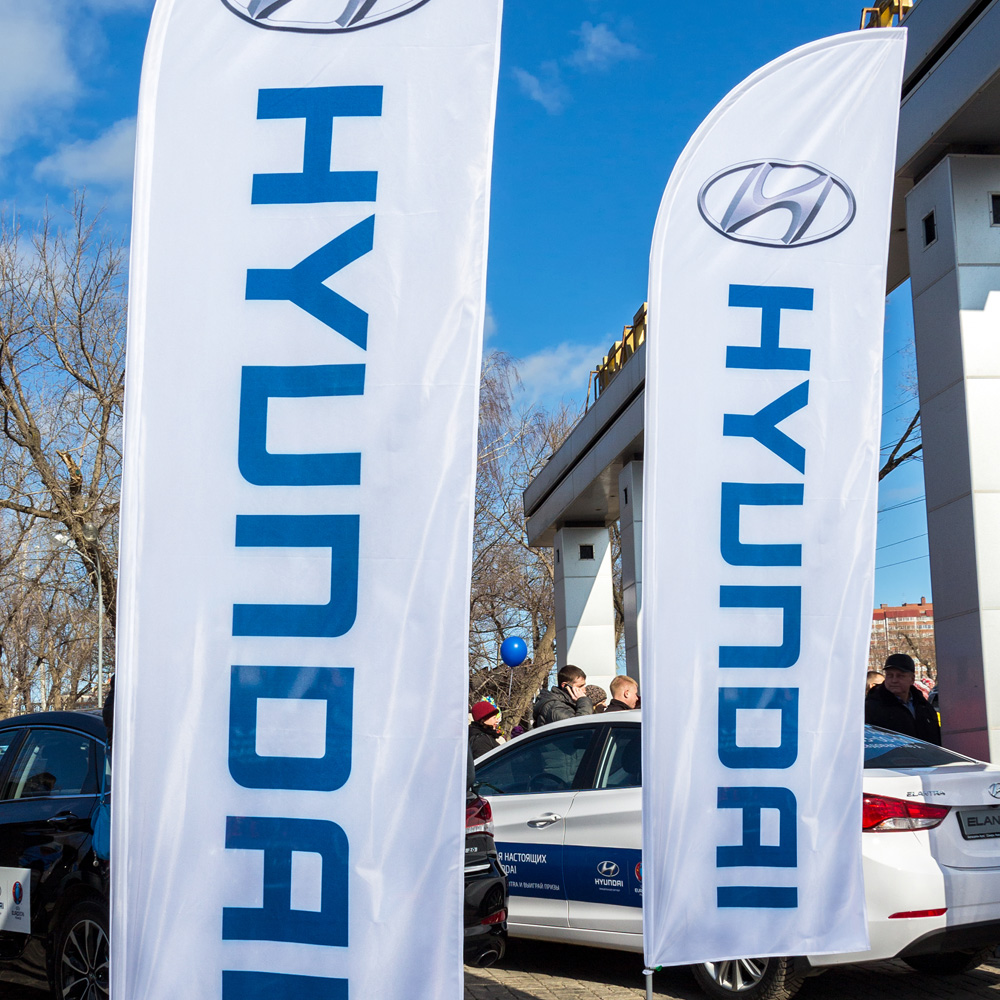 Promotional flag advertising at a car showroom