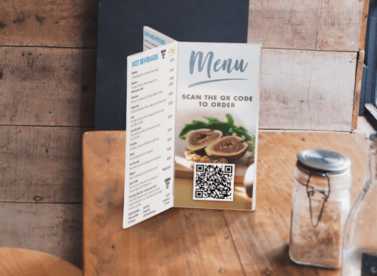 Clear menu holder on a restaurant table