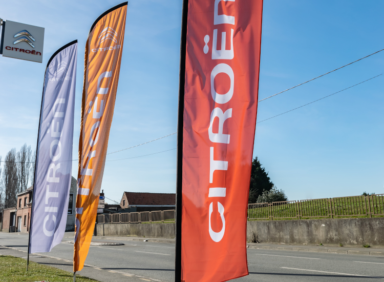 Flag advertising using teardrop flags, event flags and promotional flags. Business flags are ideal for advertising outdoors
