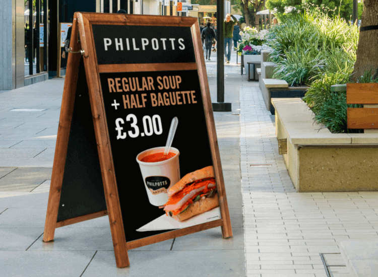 A-board with header logo design outside a cafe