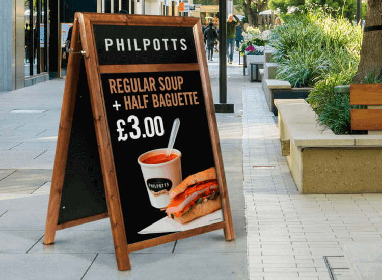 A-board with header logo design outside a cafe