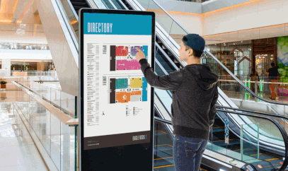 Digital touchscreen placed at the bottom of an escalator