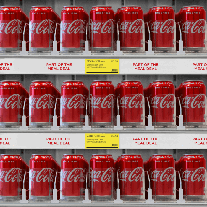 slow feed shelf pusher system for drink cans