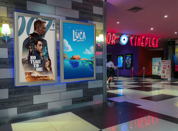 backlit posters at a cinema