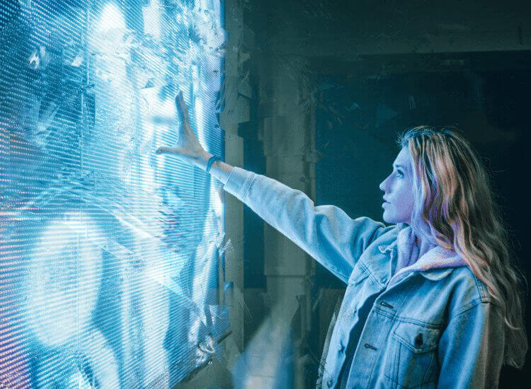 Woman reaching out to touch an interactive touchscreen display