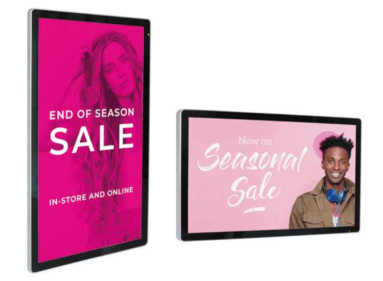 Wall mounted digital signs displaying sale information