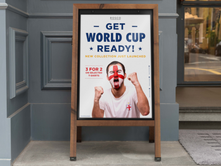 wooden pavement sign advertising a World Cup promotion