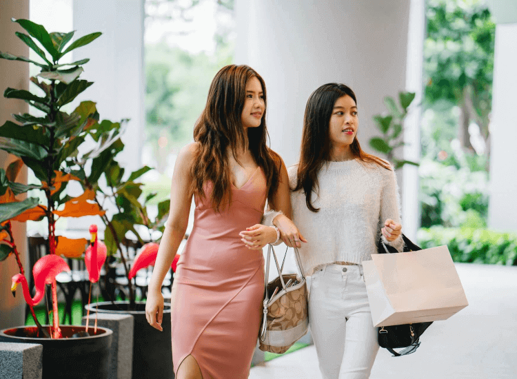 Social shoppers looking into a shop window