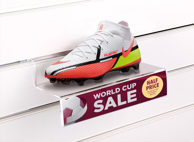 football boots with a slatwall shelf and sign