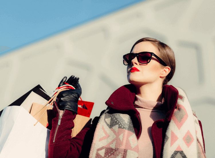 Well presented woman carrying lots of shopping bags