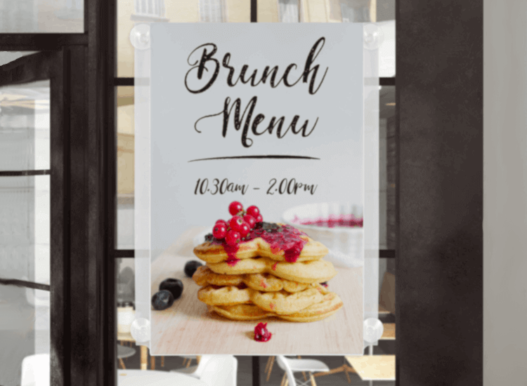 Window poster holder showing brunch times